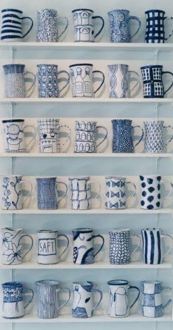 blue and white ceramic mugs and cups